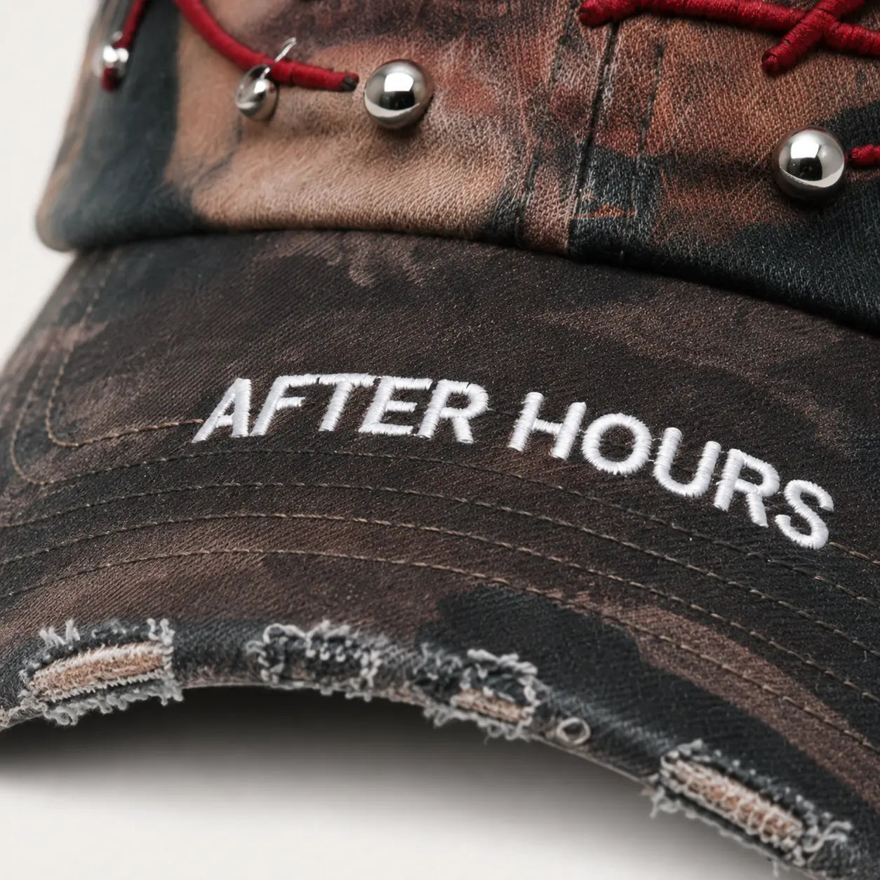 After Hours cap embroidery and distressed brim detail